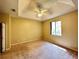 Well-lit bedroom featuring a ceiling fan and plush carpeting at 2352 Nw 53Rd Avenue Rd, Ocala, FL 34482