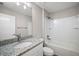 Clean bathroom, granite countertop, and a shower/tub combo at 30 Hemlock Run, Ocala, FL 34480