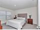 Serene bedroom featuring a plush bed, neutral colors, and ample natural light at 3775 Sw 127Th Lane Rd, Ocala, FL 34473