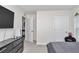 Bedroom showcasing neutral walls, gray carpet, and modern black furniture at 3775 Sw 127Th Lane Rd, Ocala, FL 34473