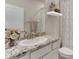 Modern bathroom featuring granite countertops and a white vanity at 4062 Nw 48Th Terrace Rd, Ocala, FL 34482