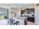 Modern kitchen with granite countertops and dark brown cabinets at 4074 Nw 48Th Terrace Rd, Ocala, FL 34482