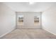 Neutral bedroom with carpet and two windows providing ample natural light at 4470 Nw 2Nd Ct, Ocala, FL 34475