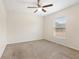 Bedroom featuring neutral paint scheme, carpeted flooring, and ceiling fan at 4470 Nw 2Nd Ct, Ocala, FL 34475