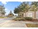 View of St. James Park community entrance, showcasing stone signage, mature trees, and gated access at 4470 Nw 2Nd Ct, Ocala, FL 34475