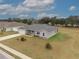 Lovely single story home with a gray roof, an attached two car garage and appealing landscaping at 4470 Nw 2Nd Ct, Ocala, FL 34475