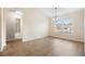 Open living area with wood-look flooring, natural light, and views into the bathroom at 4470 Nw 2Nd Ct, Ocala, FL 34475