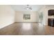 Bright living room with wood-look floors, slider to the backyard, and natural light at 4470 Nw 2Nd Ct, Ocala, FL 34475