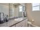 Bright bathroom featuring single sink, granite countertop, and shower with white subway tile at 4760 Nw 39Th Street Rd, Ocala, FL 34482