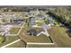 Wide aerial view of home surrounded by white fencing, showcasing its prime location within the neighborhood at 6215 Se 13Th St, Ocala, FL 34472