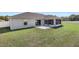 Aerial shot of backyard, screened in patio, and grassy lawn at 6215 Se 13Th St, Ocala, FL 34472