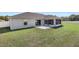 Expansive backyard with a well-maintained lawn and a screened lanai at 6215 Se 13Th St, Ocala, FL 34472