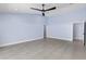 Spacious bonus room with neutral walls, tile flooring, and ample natural light, perfect for flexible living at 6215 Se 13Th St, Ocala, FL 34472