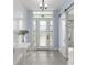 Charming foyer with a sliding barn door, console table, and decorative lighting fixture at 6215 Se 13Th St, Ocala, FL 34472