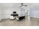 Spacious living room with a modern fireplace and comfortable seating arrangement at 6215 Se 13Th St, Ocala, FL 34472