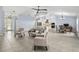 Open-concept living room with views into the kitchen and dining area, perfect for entertaining at 6215 Se 13Th St, Ocala, FL 34472