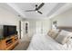 View of spacious main bedroom with ceiling fan, carpet, and a walk-in closet at 6215 Se 13Th St, Ocala, FL 34472