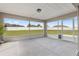 This screened in patio has concrete flooring, neutral finish, and a view of the backyard at 6215 Se 13Th St, Ocala, FL 34472