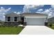 Charming single-story home with stone accents, a two-car garage, and a well-manicured lawn at 6238 Sw 93Rd Loop, Ocala, FL 34476