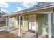 Inviting home entry with covered porch, white door and well-kept facade at 6302 Nw 57Th Ave, Ocala, FL 34482