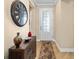 Entryway with wooden floor, clock, and console table at 7454 Sw 101St Ave, Ocala, FL 34481