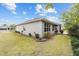 Exterior view of the home with a well-maintained lawn at 7454 Sw 101St Ave, Ocala, FL 34481