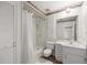 Clean bathroom with shower/tub combo, vanity, and a toilet at 7601 Se 22Nd Ave, Ocala, FL 34480