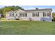 Single-story home with gray siding and landscaping at 7601 Se 22Nd Ave, Ocala, FL 34480