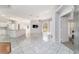 Spacious living room featuring tile floors, recessed lighting, and sliding glass doors to the back porch at 7670 Se 110Th Street Rd, Belleview, FL 34420