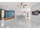 Spacious living room featuring an open layout, tile flooring, and coffered ceiling design at 7670 Se 110Th Street Rd, Belleview, FL 34420