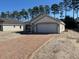 Beautiful one-story home with a brick driveway and attached two-car garage at 7673 Sw 180Th Cir, Dunnellon, FL 34432