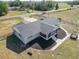 Aerial view of the home, showing its new roof, large lot and screened patio at 7688 Se 135Th St, Summerfield, FL 34491