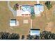 Stunning aerial view of a unique estate with a screened pool and multiple outbuildings at 7688 Se 135Th St, Summerfield, FL 34491