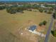 An aerial view of the home and the expansive, fenced-in yard at 7688 Se 135Th St, Summerfield, FL 34491