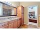 Bathroom featuring cabinets, drawers, and a view to the kitchen at 7688 Se 135Th St, Summerfield, FL 34491