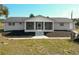 A charming single-story home with a screened-in porch and manicured lawn at 7688 Se 135Th St, Summerfield, FL 34491