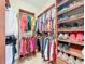 Well-organized walk-in closet with built-in shelves and rods for ample storage at 7688 Se 135Th St, Summerfield, FL 34491