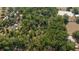 Property with multiple buildings and lush trees at 7740 Sw 70Th Ave, Ocala, FL 34476