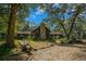 A home with a stone chimney surrounded by trees at 7740 Sw 70Th Ave, Ocala, FL 34476