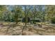 House surrounded by large trees and a spacious yard at 7740 Sw 70Th Ave, Ocala, FL 34476