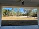 A view of the wooded back lot from the covered back porch at 8481 Sw 137 Ct, Dunnellon, FL 34432