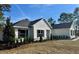 Beautiful single story home featuring manicured landscaping, a modern design, and inviting curb appeal at 8481 Sw 137 Ct, Dunnellon, FL 34432