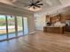 Open floor plan with kitchen featuring an island, stainless appliances, and adjacent to the living room at 8481 Sw 137 Ct, Dunnellon, FL 34432