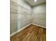 Walk-in closet featuring wood-style floors and white shelving at 8481 Sw 137 Ct, Dunnellon, FL 34432