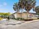 Clubhouse exterior with palm trees and lush landscaping at 8510 Sw 108Th Place Rd, Ocala, FL 34481