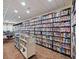 Library with floor-to-ceiling bookshelves filled with a wide variety of books at 8510 Sw 108Th Place Rd, Ocala, FL 34481