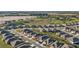 Sweeping aerial photograph of a residential development adjacent to a golf course and natural areas at 8630 Sw 61St Loop, Ocala, FL 34481