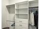 Spacious walk-in closet featuring built-in shelves and rods at 8630 Sw 61St Loop, Ocala, FL 34481