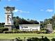 The Del Webb Stone Creek community entrance sign boasts manicured landscaping and a welcoming aesthetic at 8630 Sw 61St Loop, Ocala, FL 34481