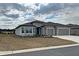 Beautiful single-story home featuring gray stucco and stone veneer at 8630 Sw 61St Loop, Ocala, FL 34481